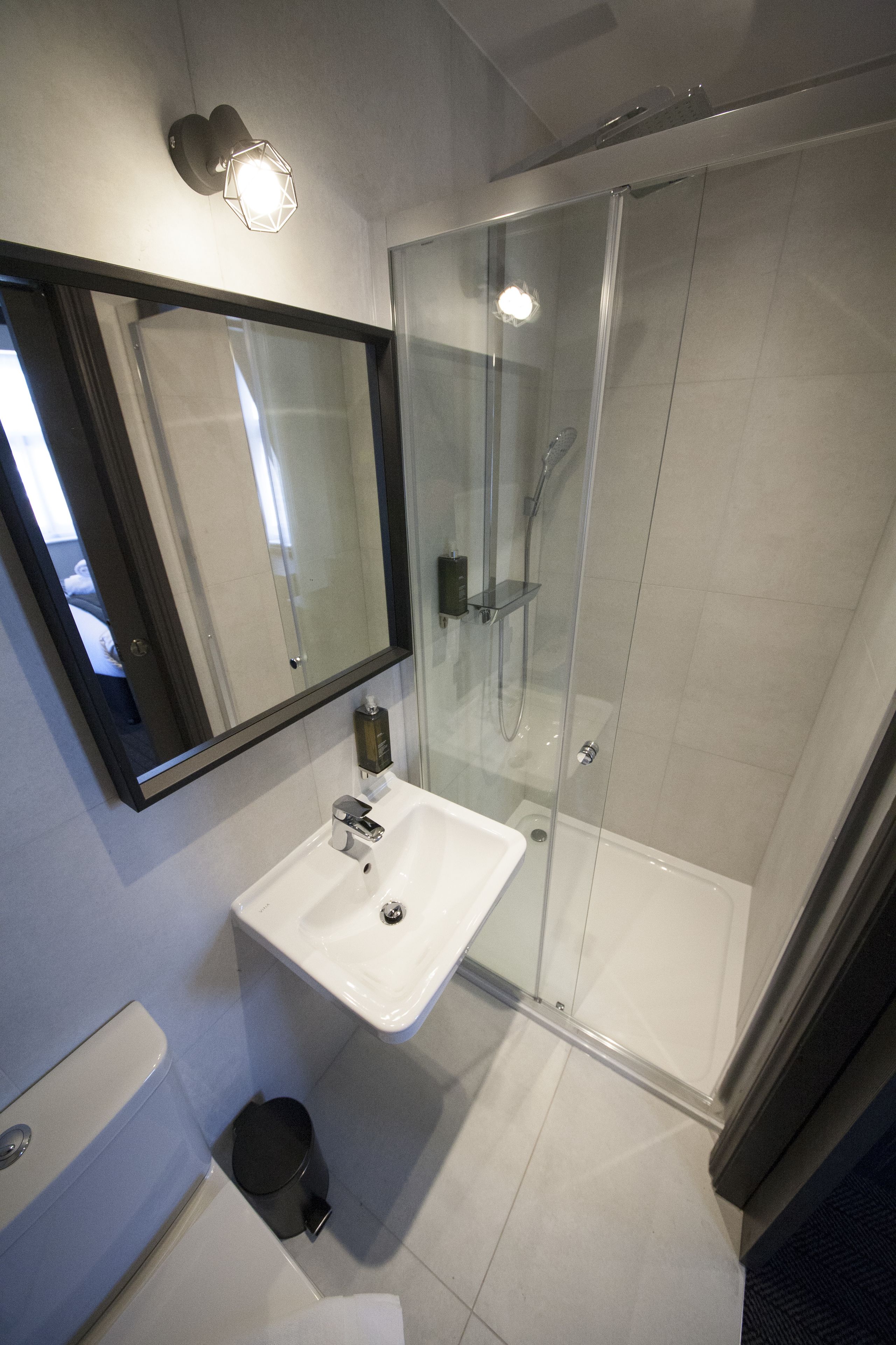 shower, designer toiletries, hair dryer, towels