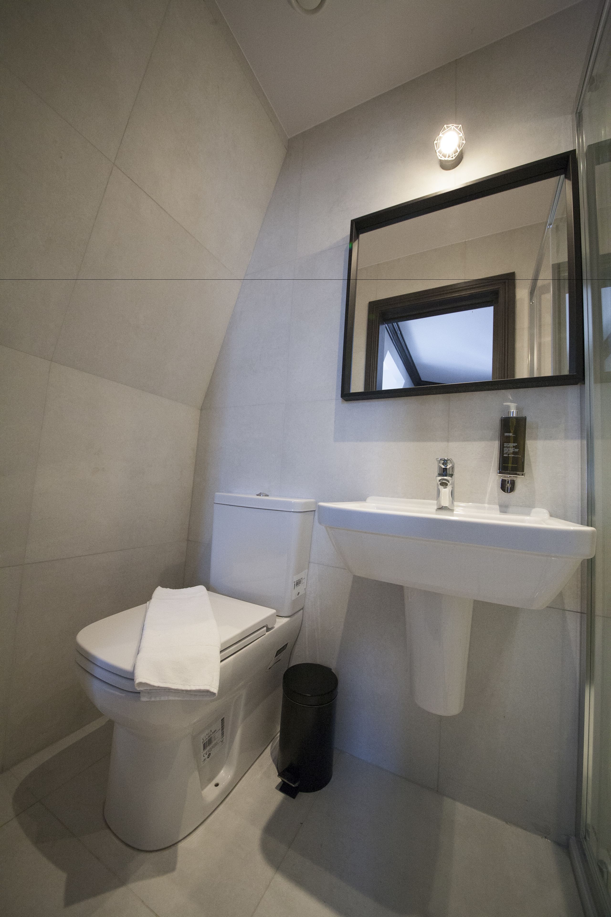 shower, designer toiletries, hair dryer, towels