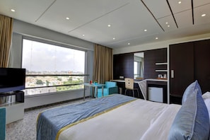 Minibar, in-room safe, desk, iron/ironing board - Hotel Pragati The Grand (Ahmedabad)