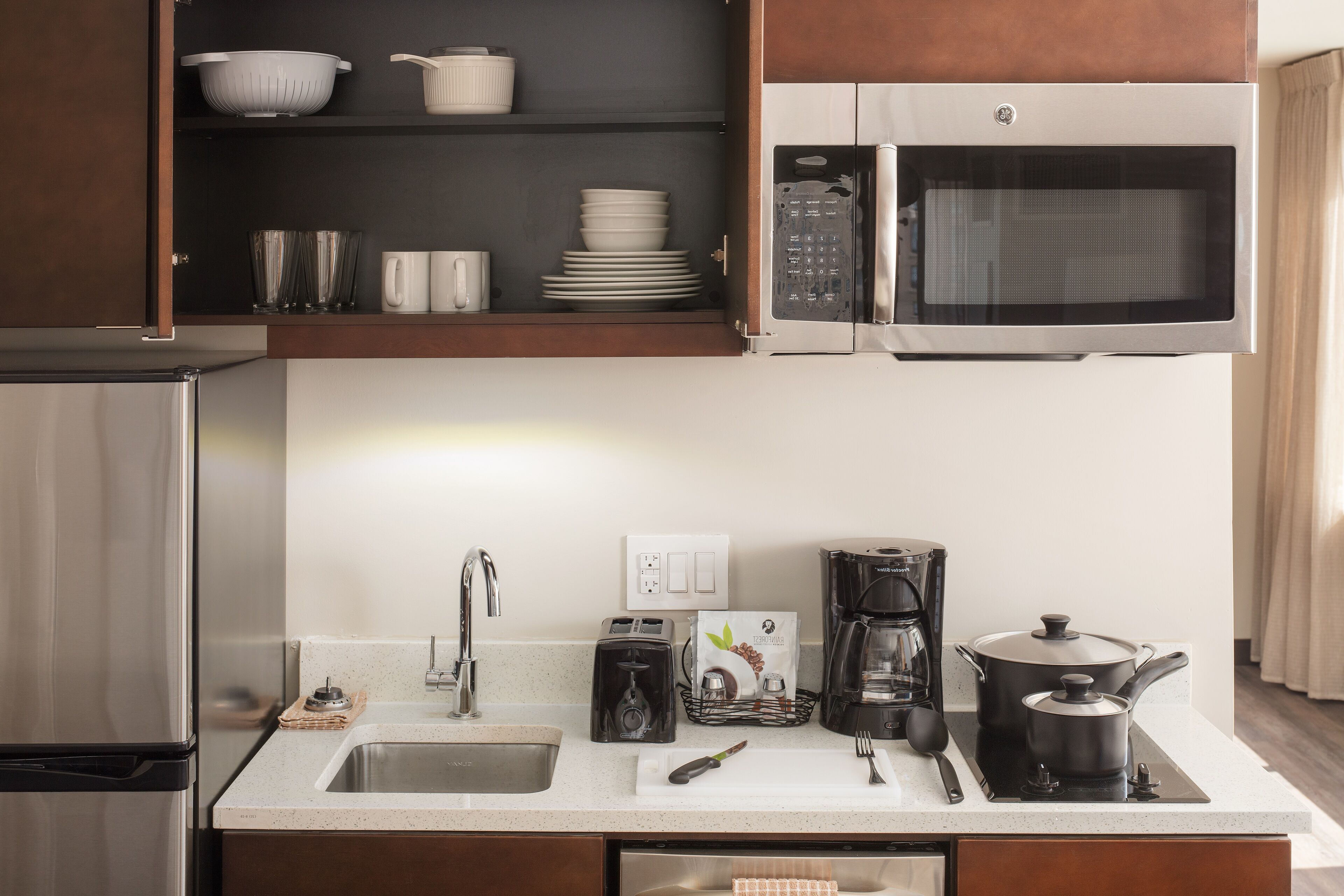 full-sized fridge, microwave, stovetop, dishwasher