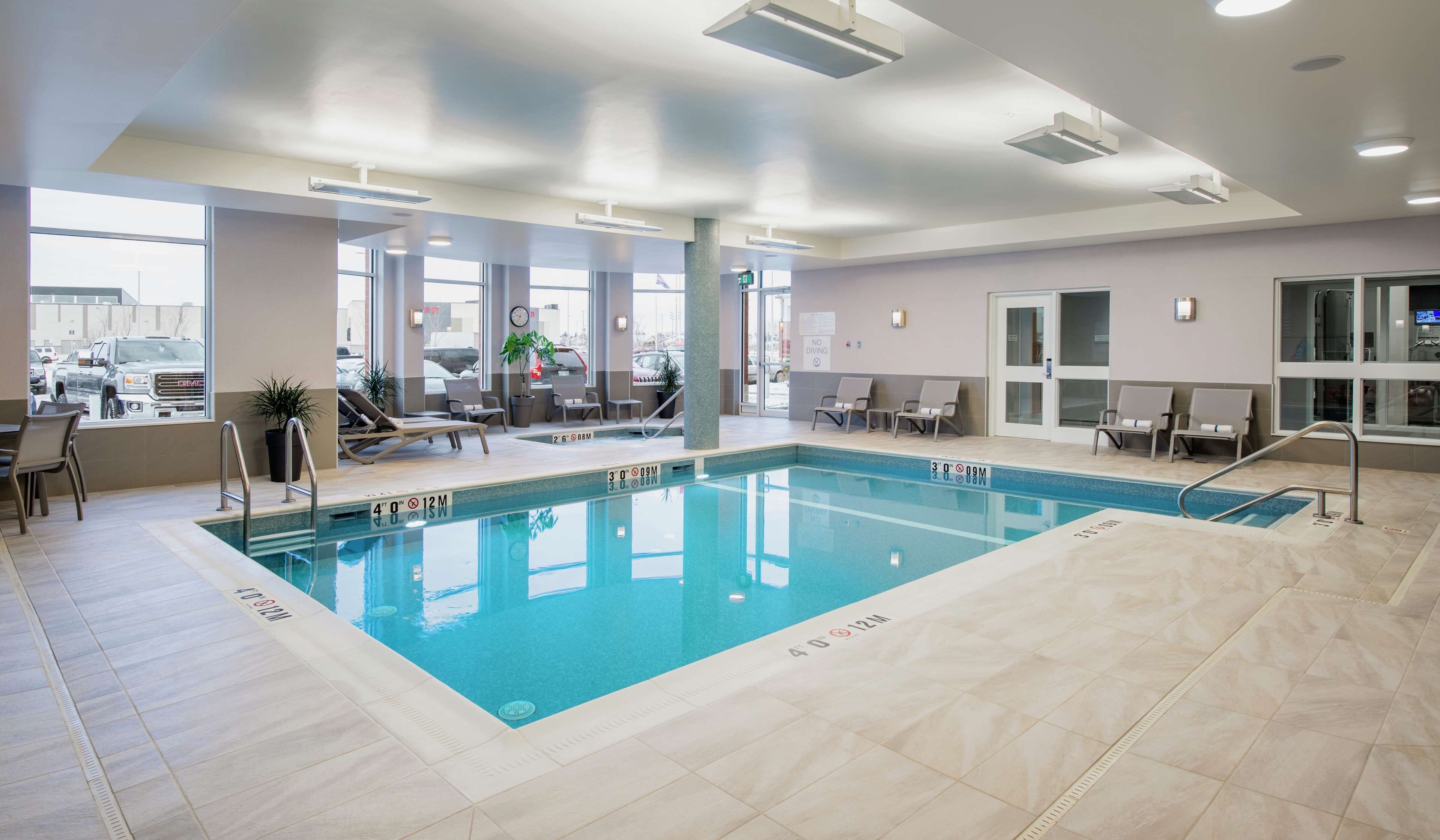 indoor pool, open 9:00 am to 10:00 pm, pool loungers