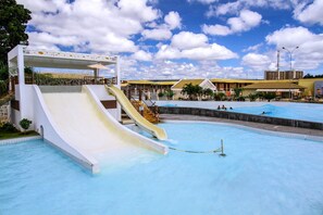 A water park with multiple slides and a large pool area.