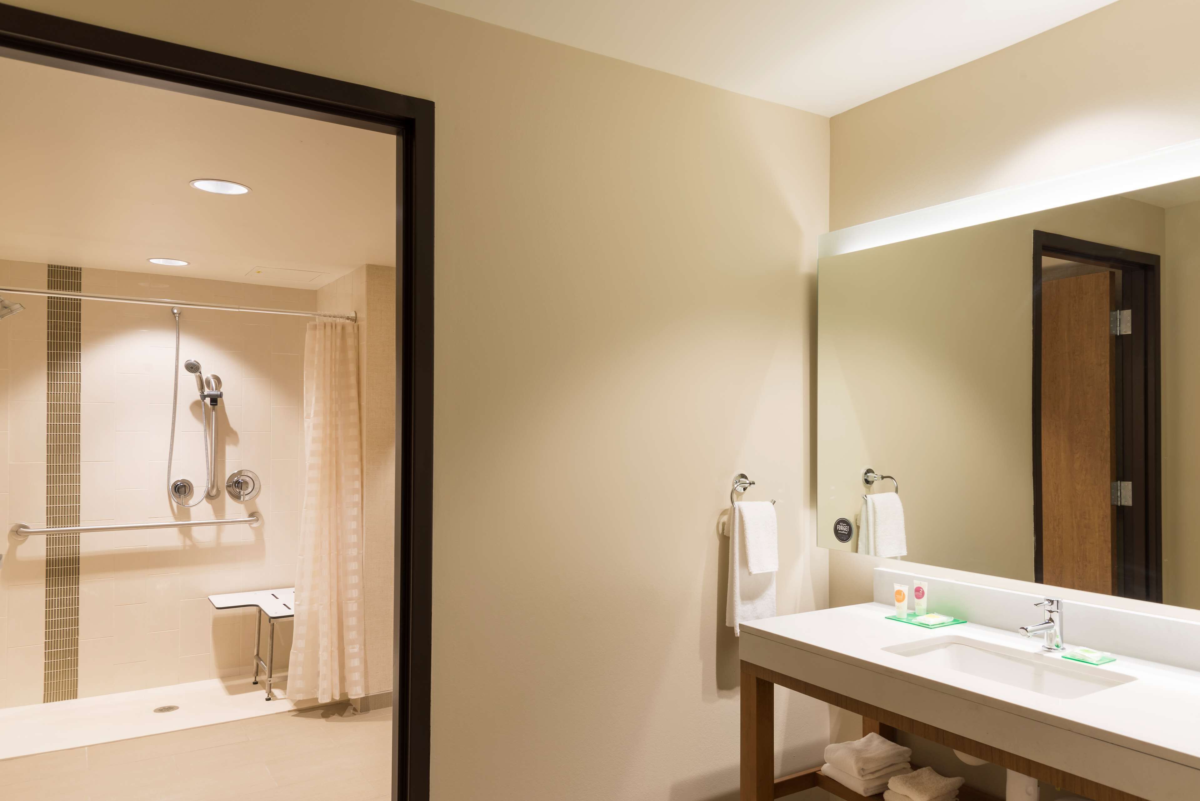 designer toiletries, hair dryer, towels