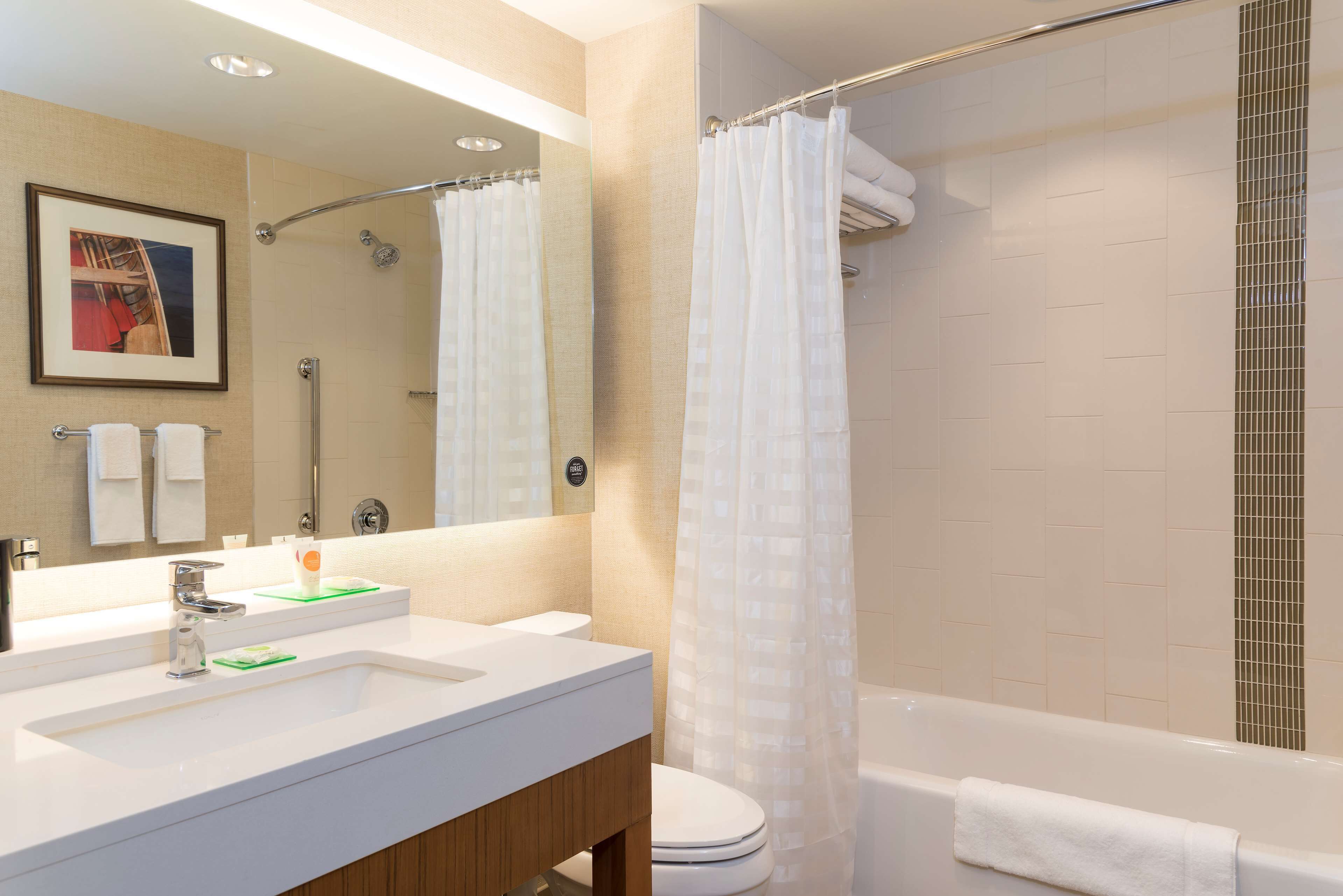 designer toiletries, hair dryer, towels