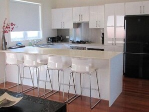 Villa, 3 Bedrooms | Private kitchen | Full-sized fridge, microwave, oven, stovetop - Sunrise Shores (Caves Beach)