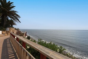 On the beach, sun-loungers
