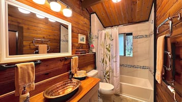 Combined shower/tub, hair dryer, towels, soap