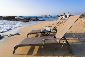 On the beach, sun loungers, beach towels