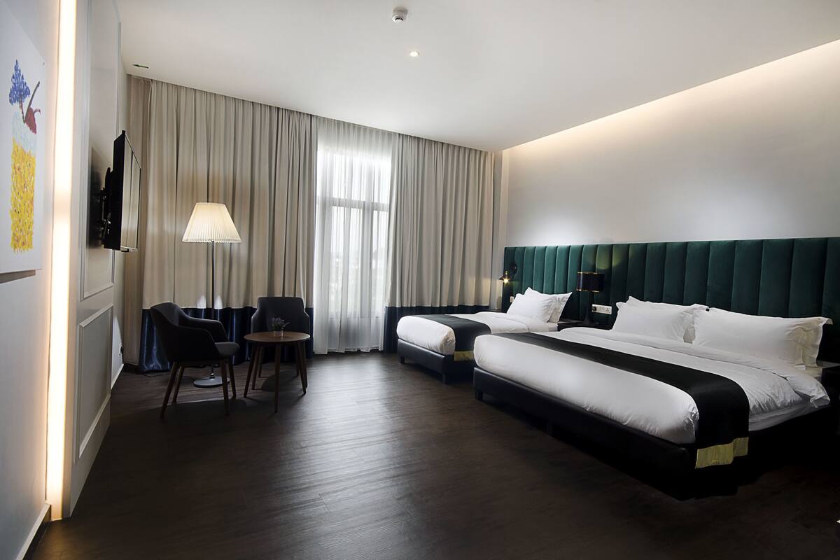 family room | 1 bedroom, desk, soundproofing, iron/ironing board