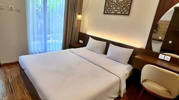 Quarto standard | Roupas de cama premium, frigobar, cofres nos quartos, escrivaninha