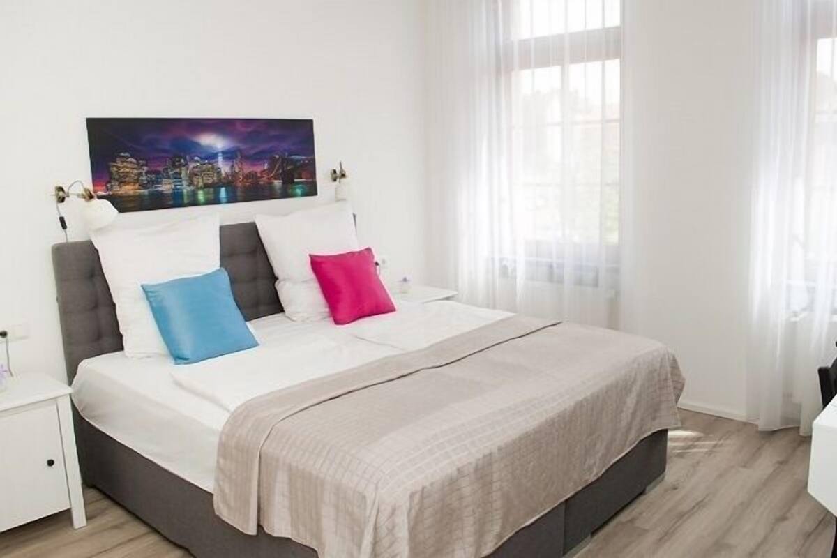 premium bedding, memory-foam beds, desk, blackout curtains