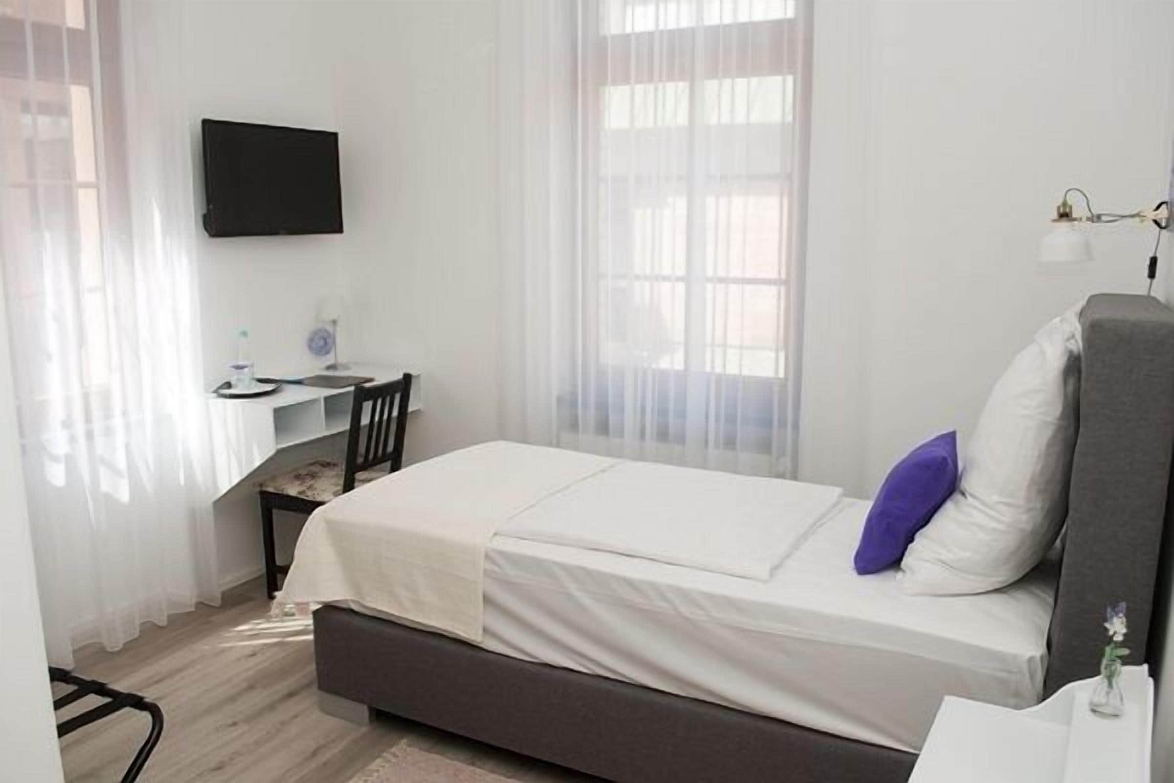 premium bedding, memory-foam beds, desk, blackout curtains