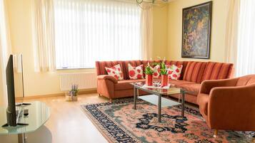 Apartment, 2 Bedrooms | Living room | 42-inch flat-screen TV with satellite channels, TV