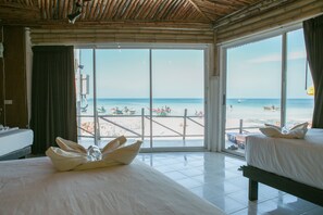 A hotel room with two beds, a large window with a beach view, and a bamboo ceiling.