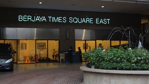 The exterior of the Berjaya Times Square East building with a fountain in the foreground. - Queens Service Suite at Times Square (Kuala Lumpur)