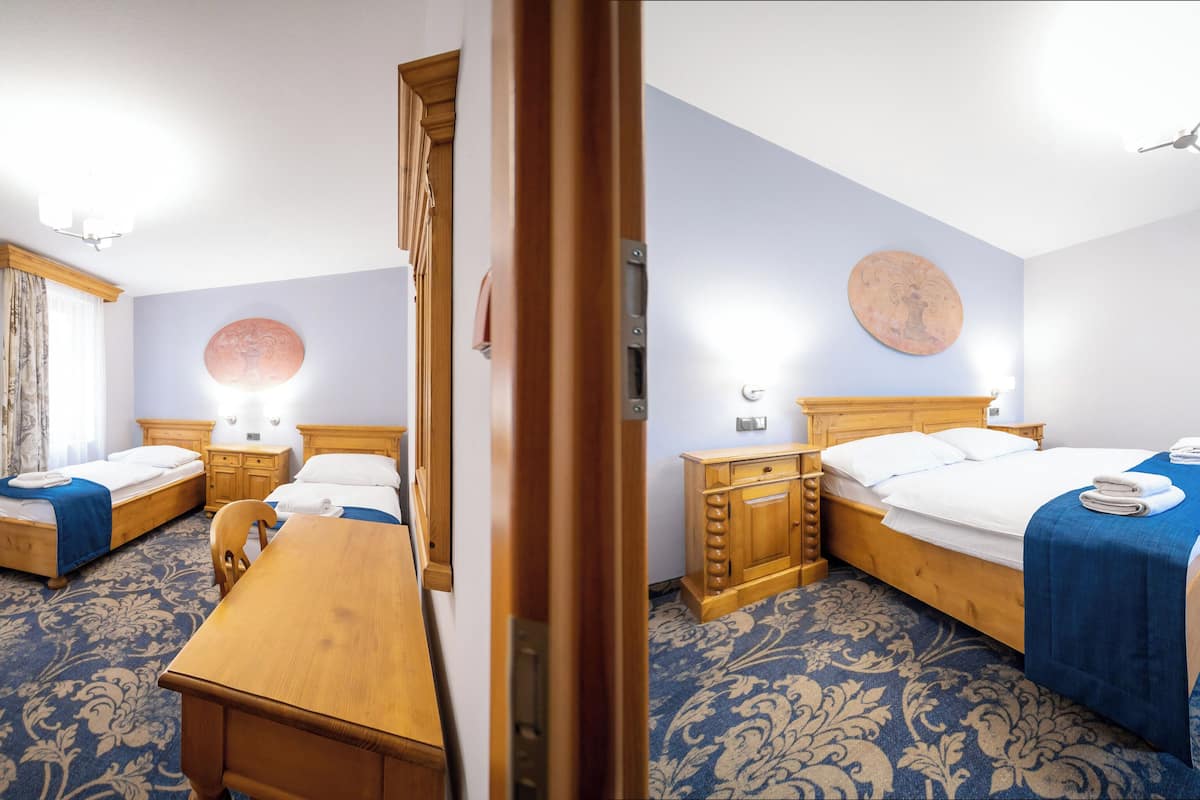 family room, 2 bedrooms | desk, laptop workspace, blackout curtains, iron/ironing board