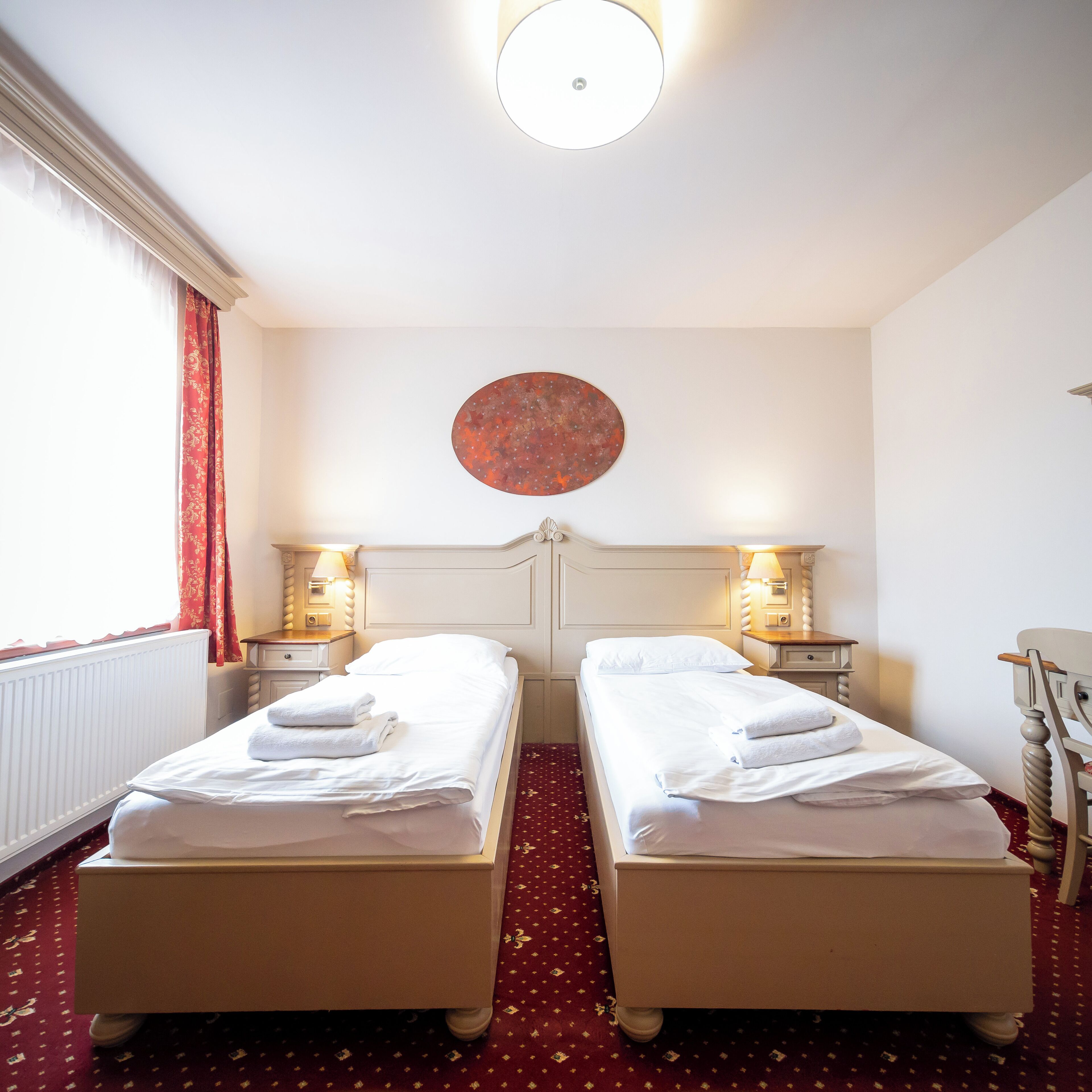 twin room | desk, laptop workspace, blackout curtains, iron/ironing board