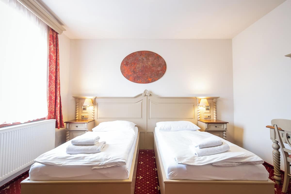 twin room | desk, laptop workspace, blackout curtains, iron/ironing board