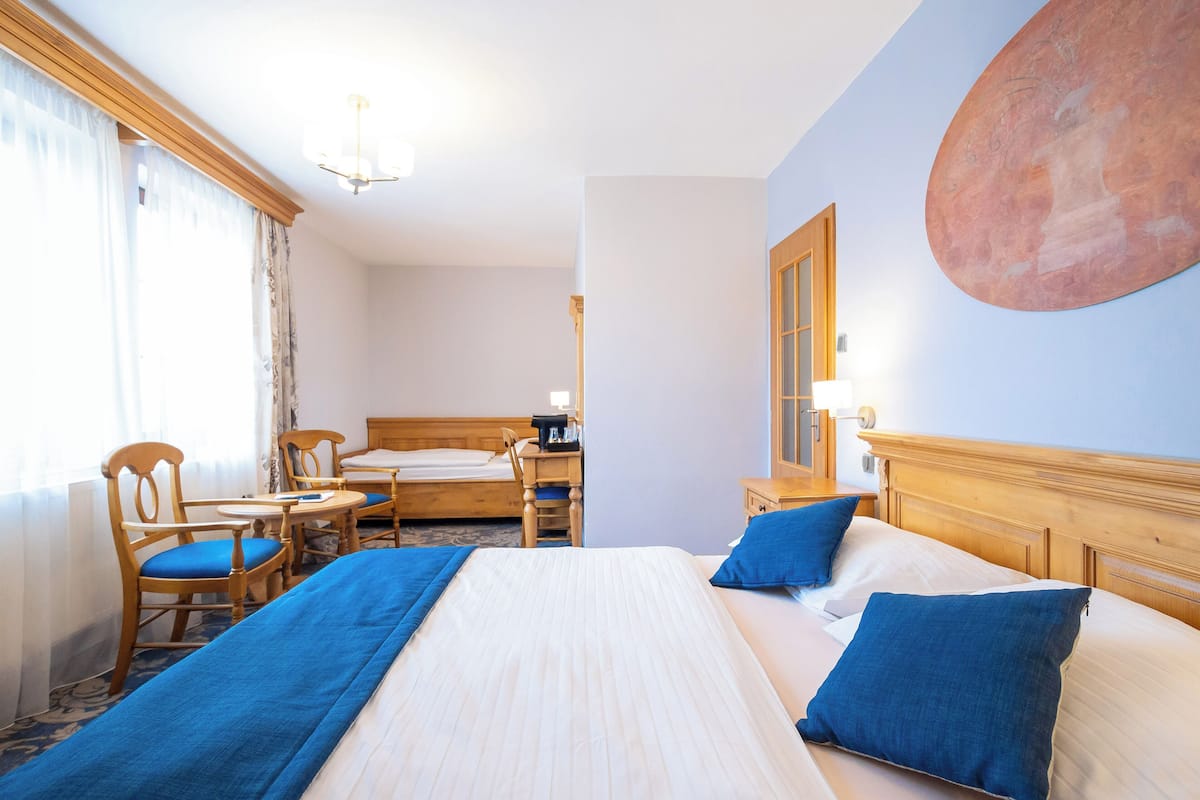 triple room | desk, laptop workspace, blackout curtains, iron/ironing board