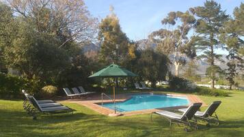 Outdoor pool, pool umbrellas, sun loungers