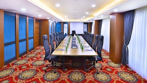 A conference room with a long table, chairs, and a carpeted floor. - Marathon Hotel (Elazig)