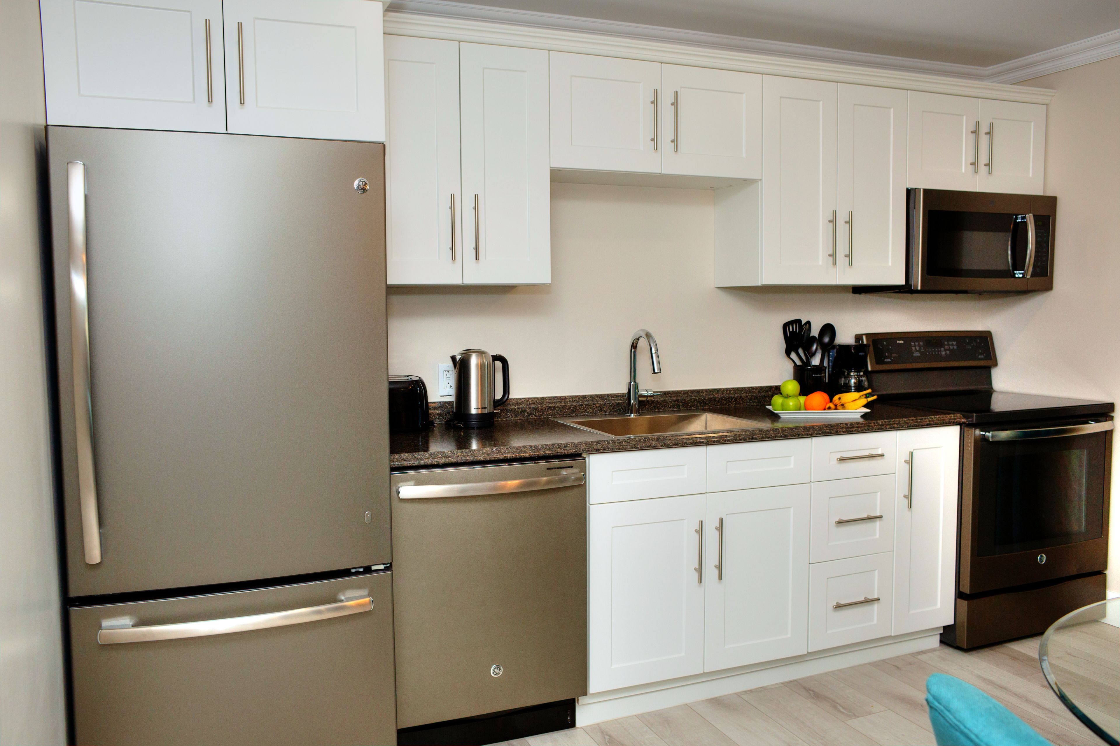 signature suite, 1 king bed, fireplace, garden area | private kitchen | fridge, coffee/tea maker