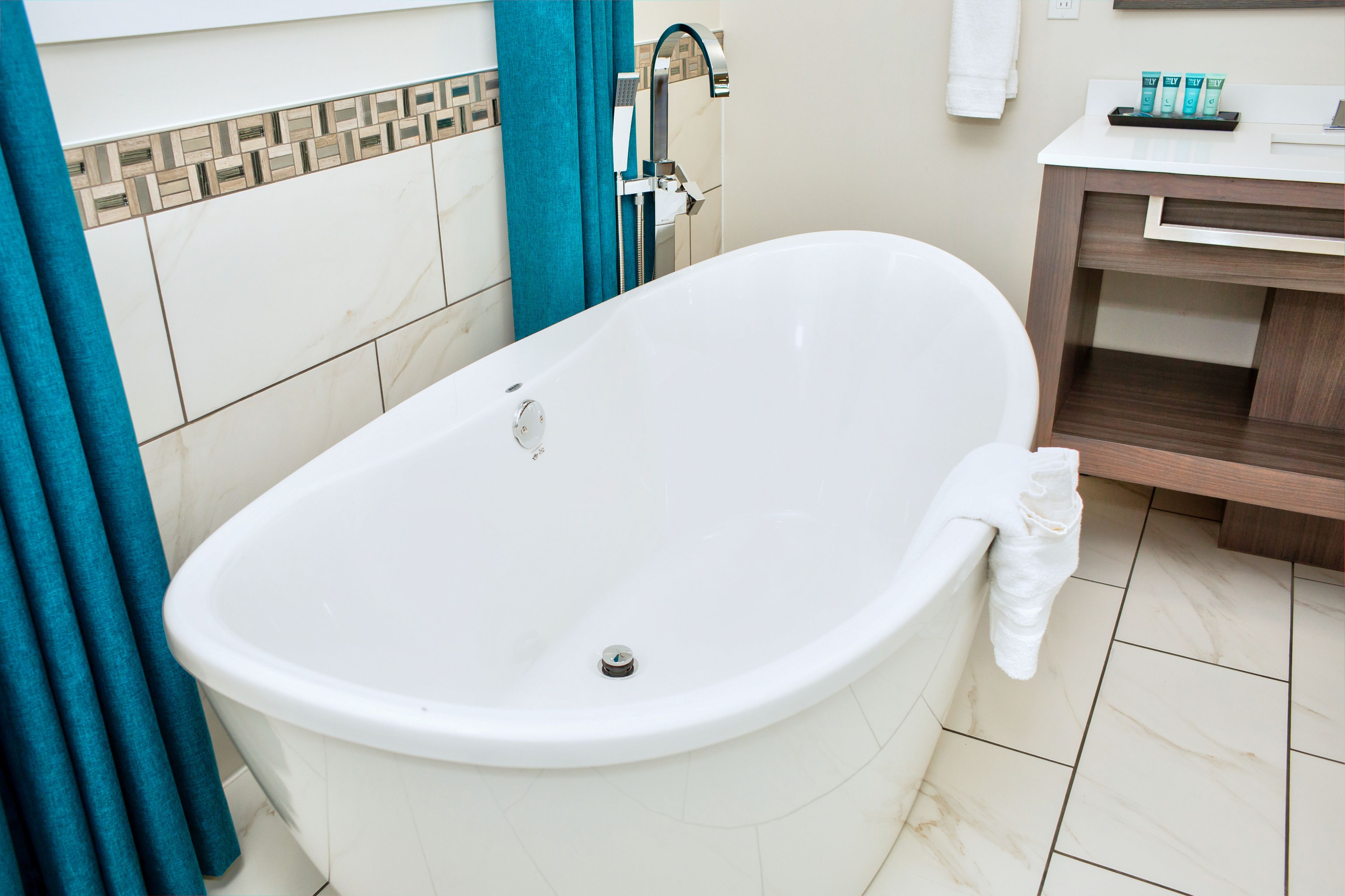 signature suite, 1 king bed, fireplace, garden area | deep-soaking bathtub