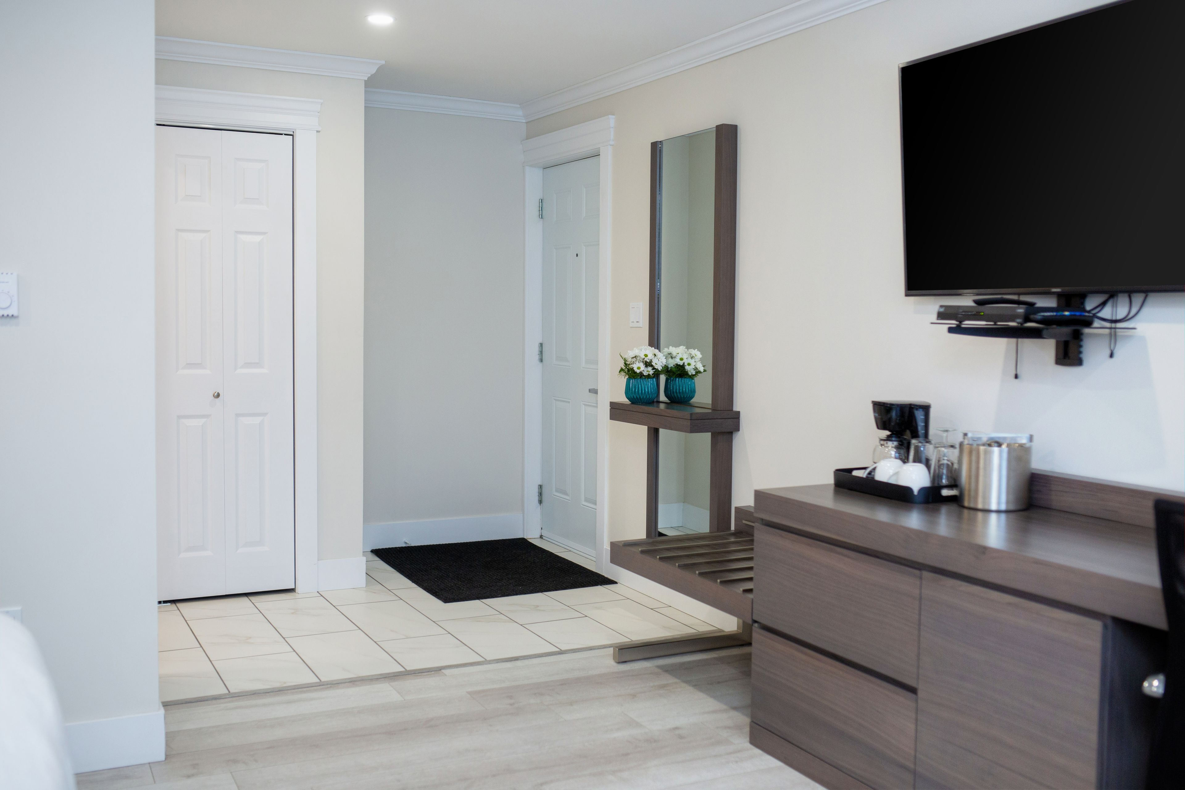 room, 1 king bed, refrigerator | living area | led tv