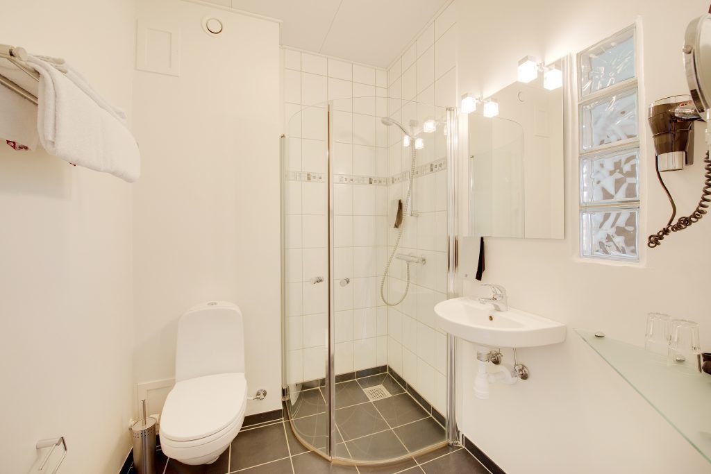 business art | bathroom | shower, free toiletries, hair dryer, towels