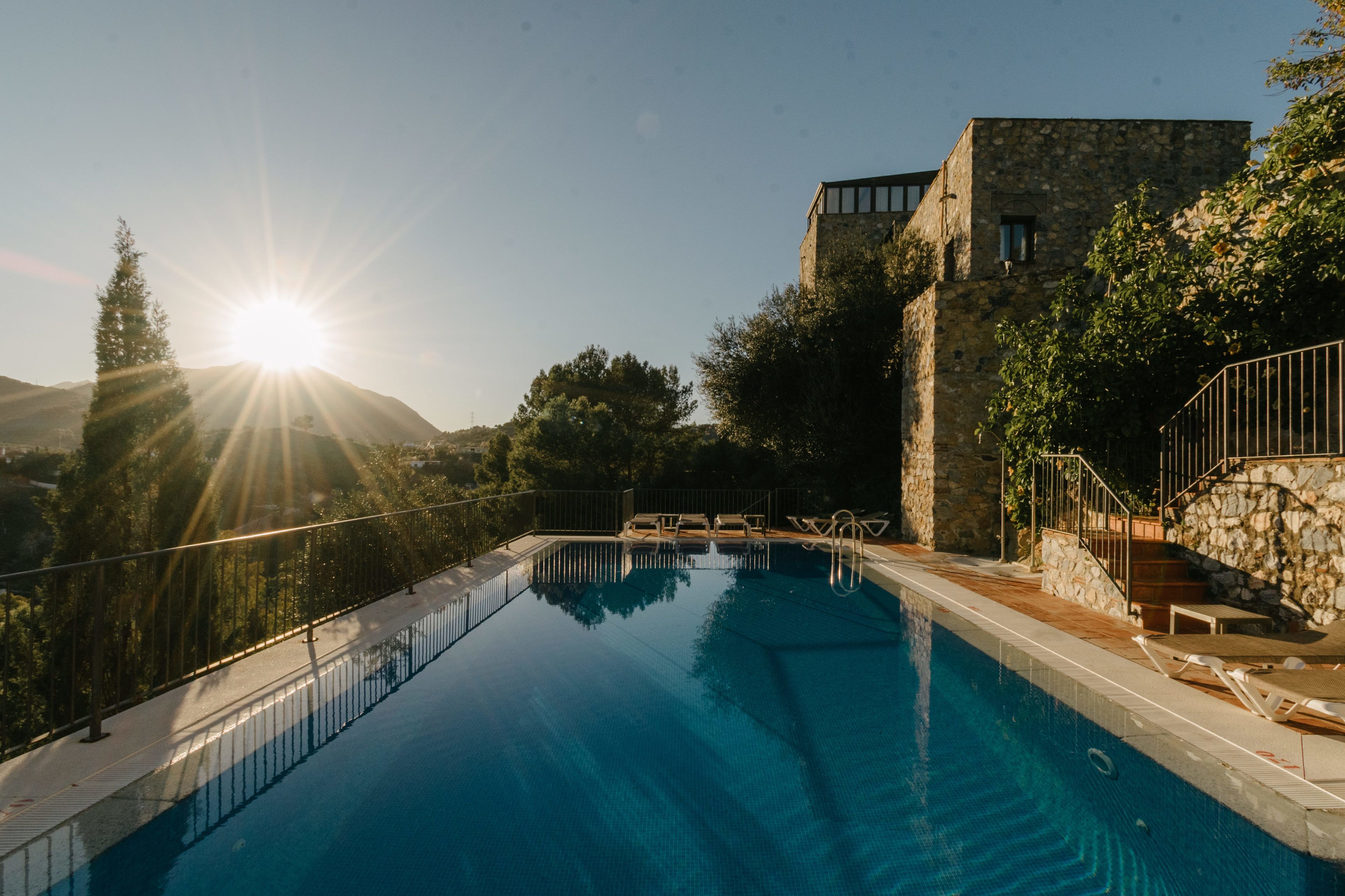 outdoor pool, open 9:00 am to 10:00 pm, pool umbrellas, pool loungers