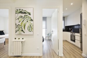 Design Apartment, 3 Bedrooms | In-room safe, desk, blackout drapes, iron/ironing board