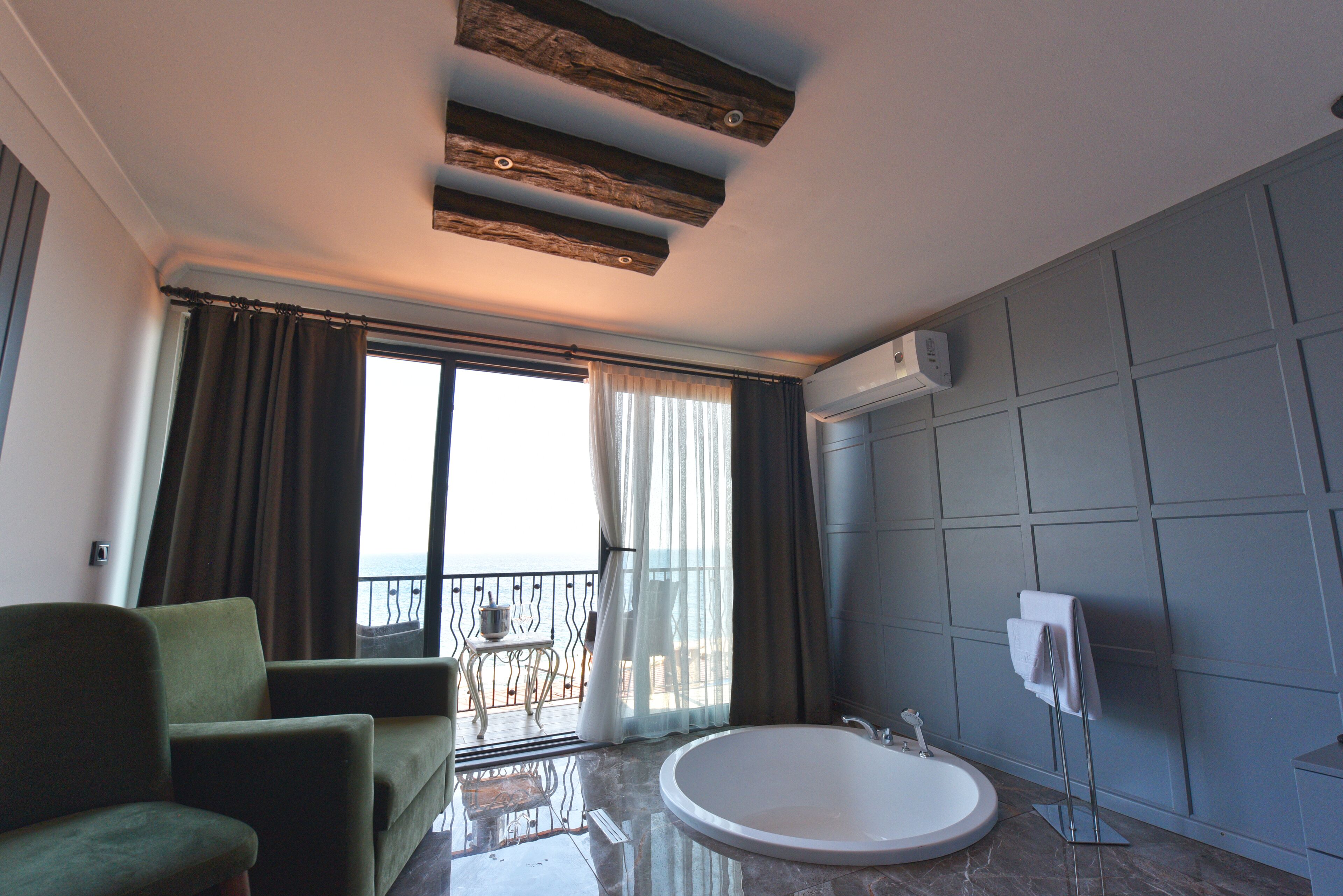 deluxe penthouse, 1 bedroom, balcony, sea view | minibar, in-room safe, individually decorated, desk