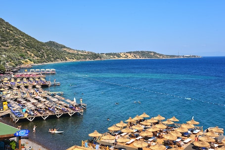 On the beach, sun loungers, beach umbrellas