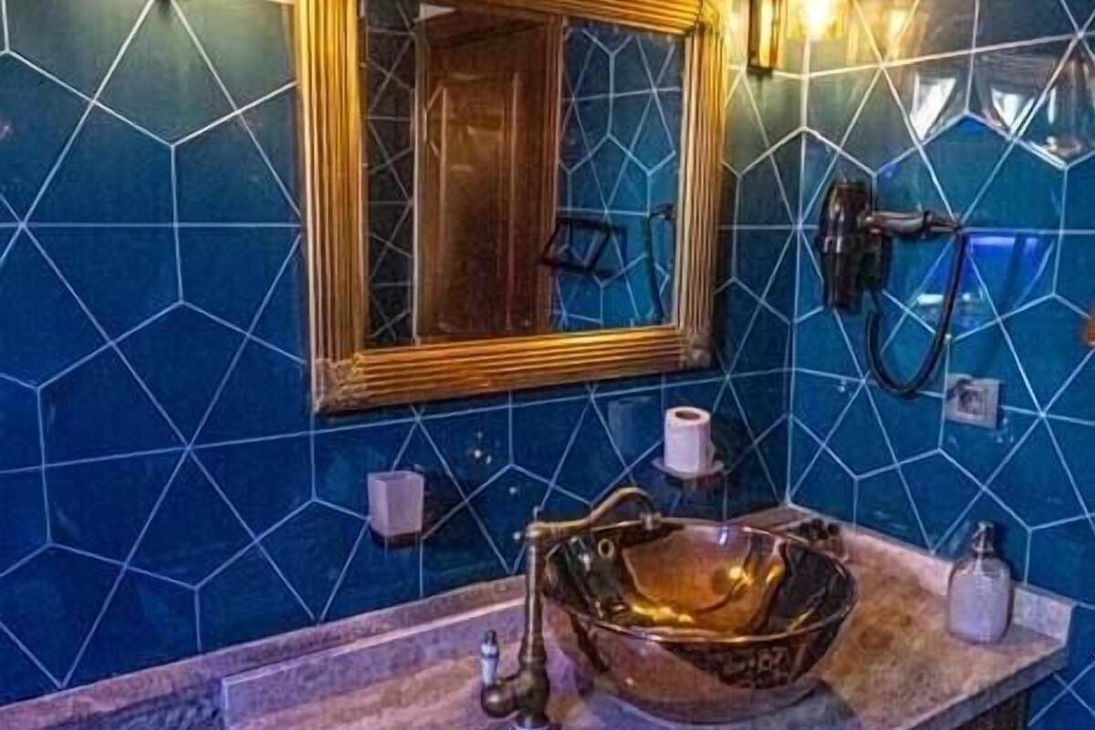 luxury penthouse | bathroom | shower, free toiletries, hair dryer, slippers