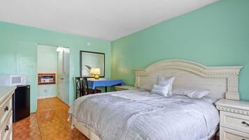 Grand Room, Pool View | Iron/ironing board, free WiFi, bed sheets