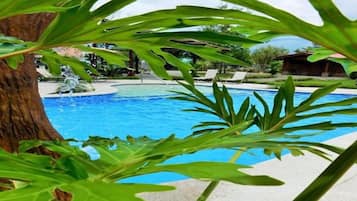 Seasonal outdoor pool, open 7:00 AM to 10:00 PM, pool umbrellas