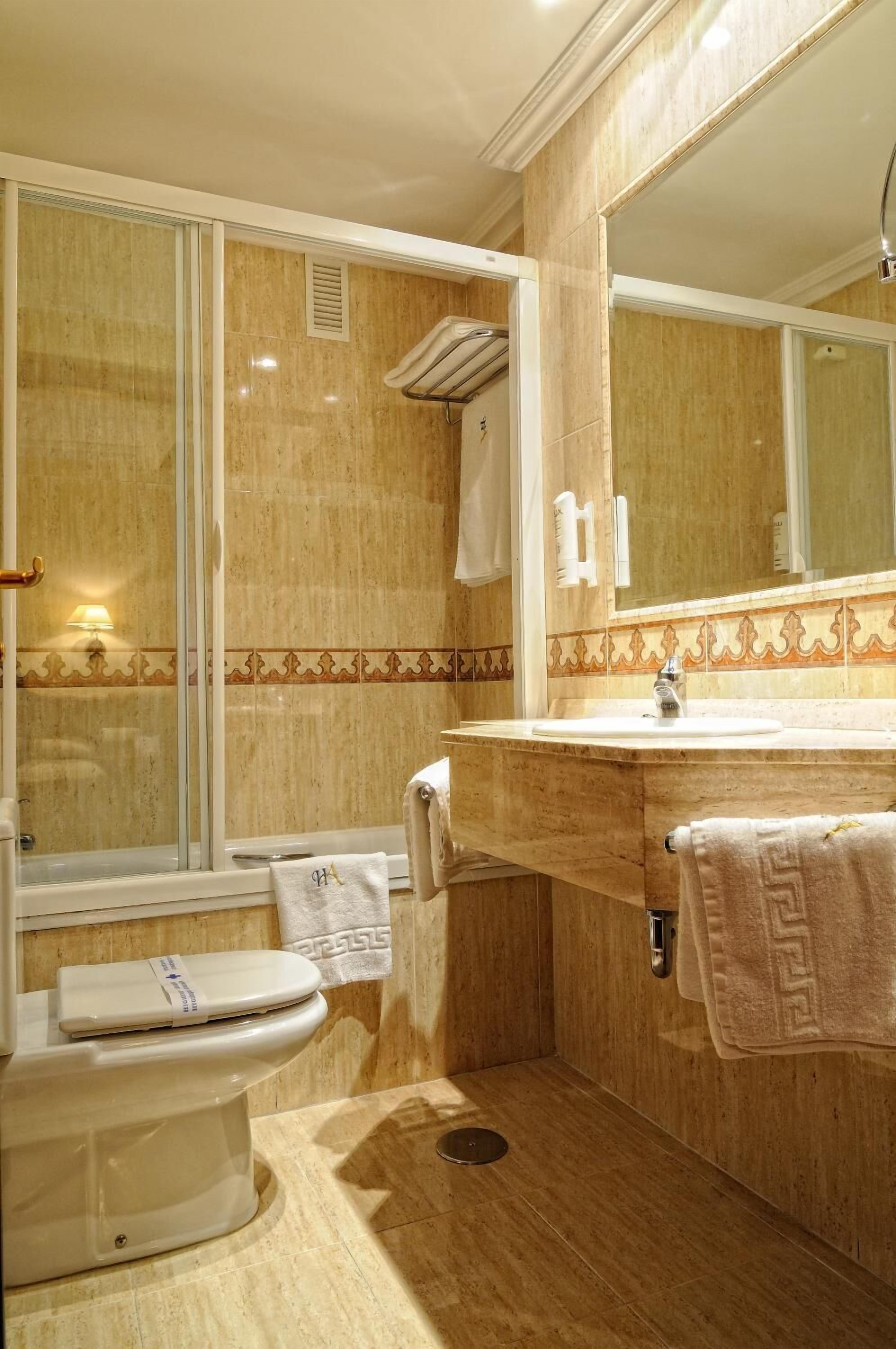 deep-soaking bathtub, free toiletries, hair dryer, towels