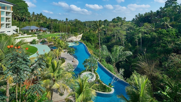 A resort with a swimming pool surrounded by lush greenery and palm trees. - The Westin Resort & Spa Ubud, Bali (Ubud)