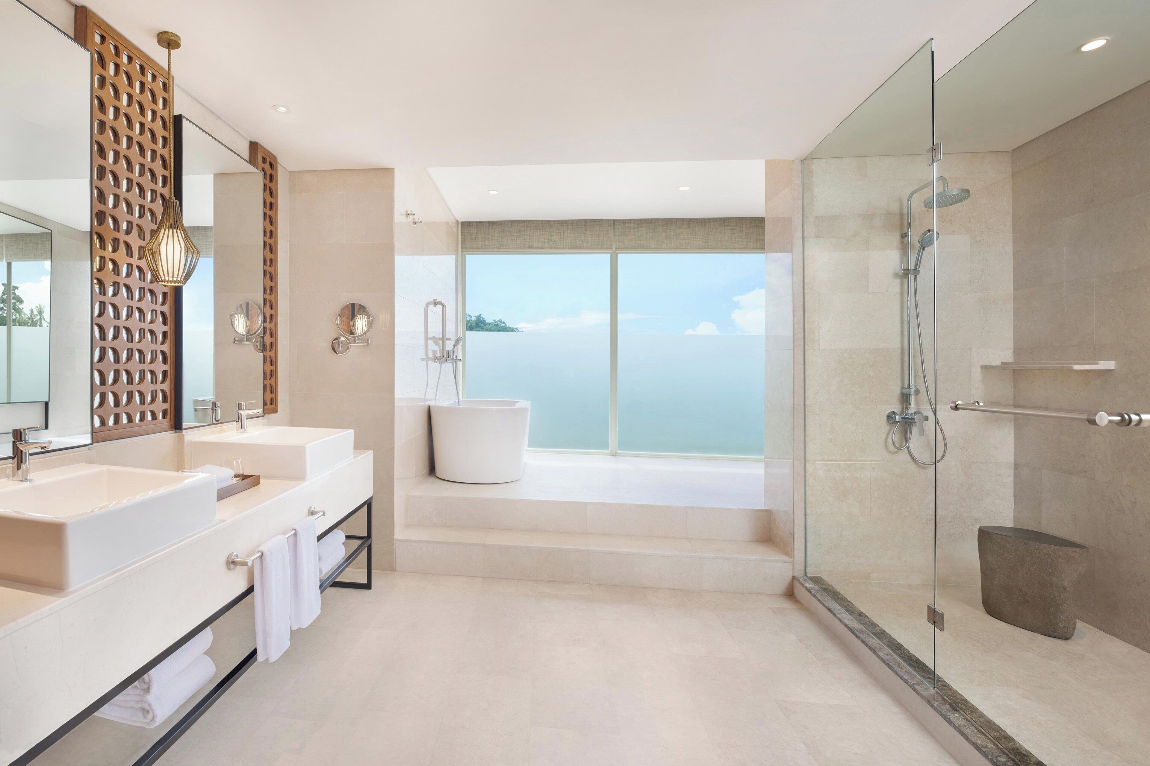 separate bathtub and shower, rainfall showerhead, designer toiletries