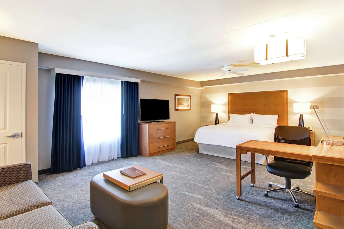 premium bedding, desk, laptop workspace, blackout curtains