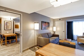 Premium bedding, desk, laptop workspace, blackout drapes