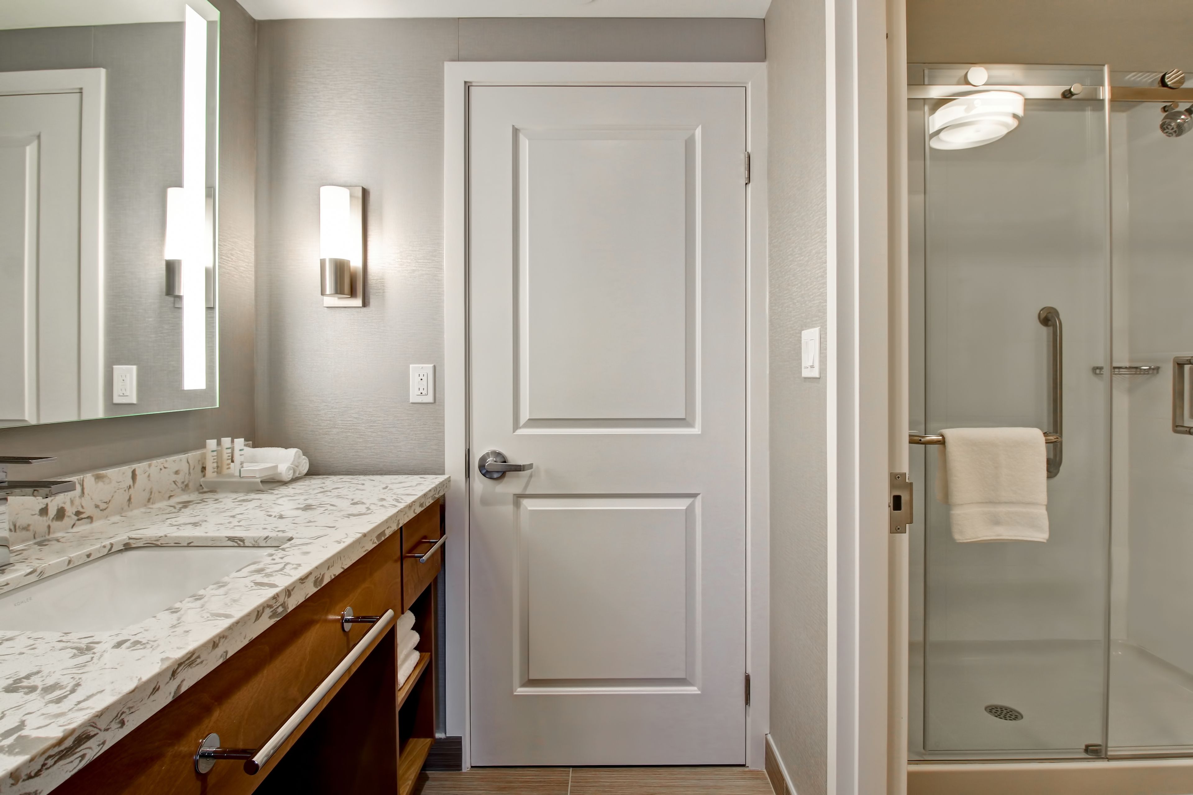 designer toiletries, hair dryer, towels