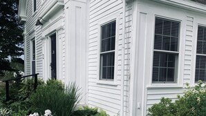 A white house with a garden in front. - The Orchard House: Inn & Cafe (Freeport)