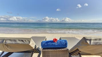 On the beach, white sand, free beach cabanas, sun loungers