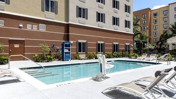 Outdoor pool, open 7 AM to 7:00 PM, pool loungers