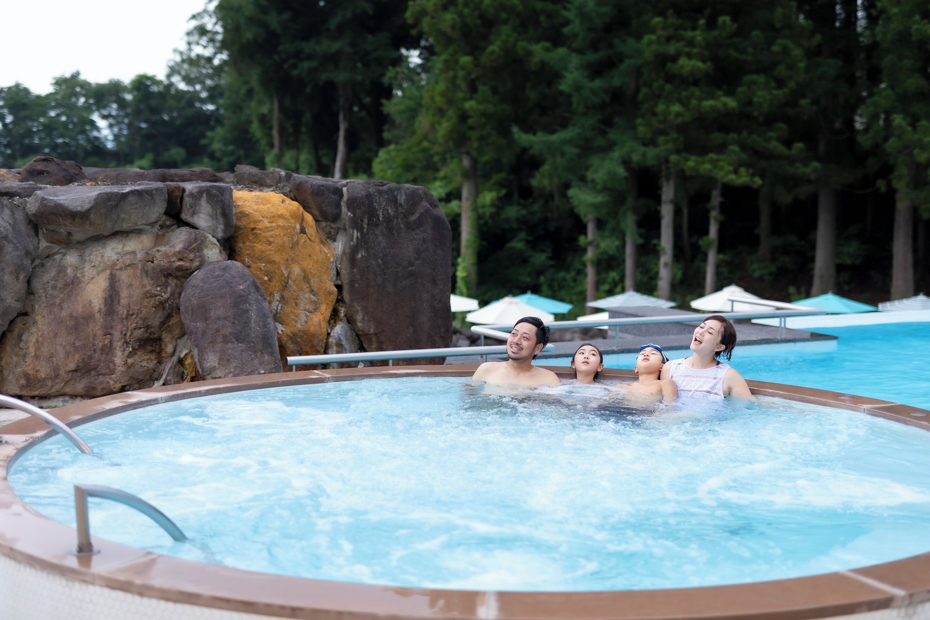 indoor pool, seasonal outdoor pool, pool umbrellas