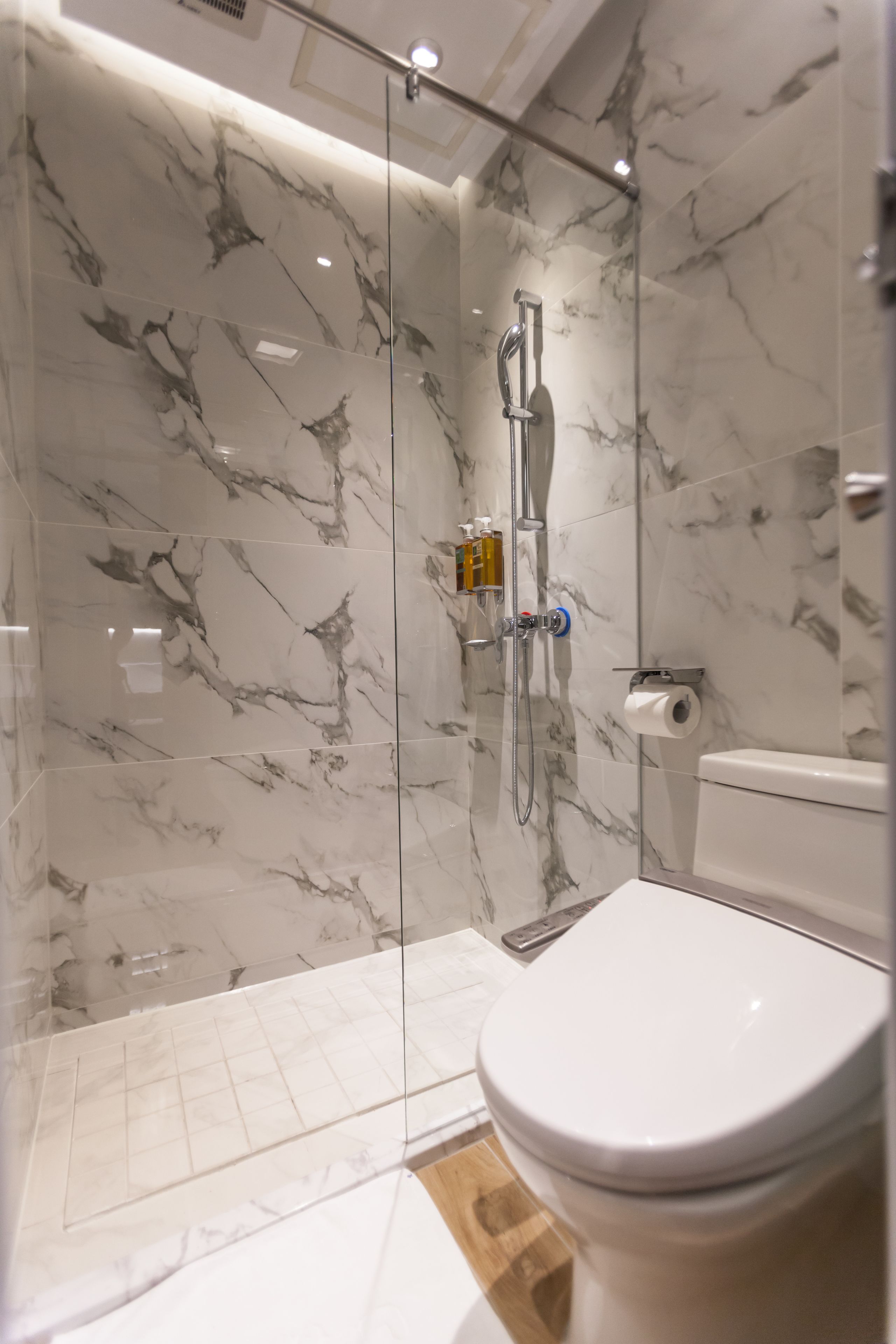 shower, hair dryer, slippers, bidet