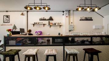 Enjoy a drink at the bar, where stools invite you to sit and relax.