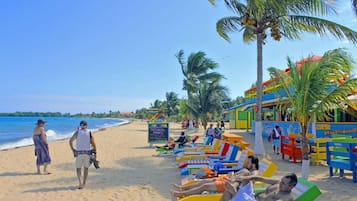 Beach nearby, white sand, beach towels