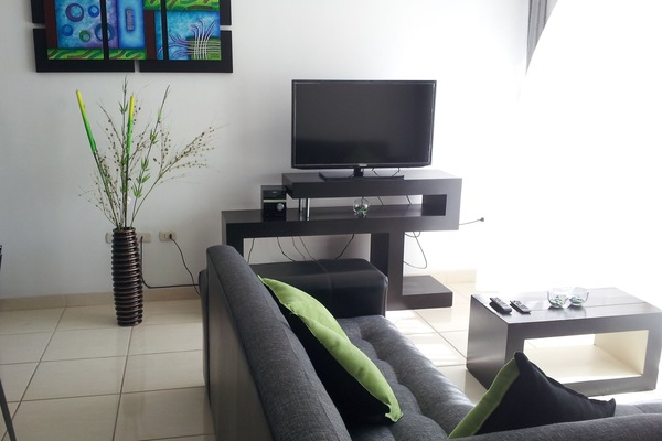 Family Room (Sextuple 2 Double and 2 Single Beds) | Living area | 32-inch flat-screen TV with cable channels, TV